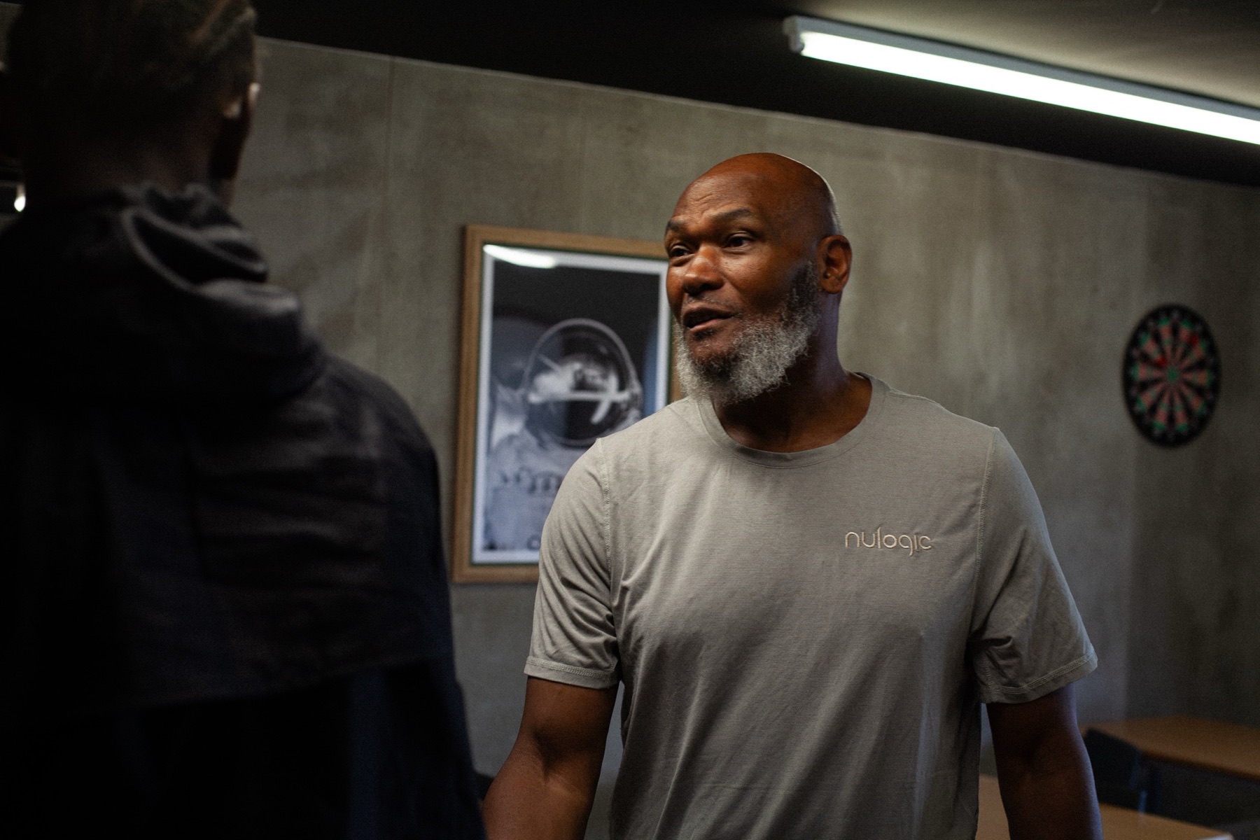 A Nulogic mentor talking with a young person